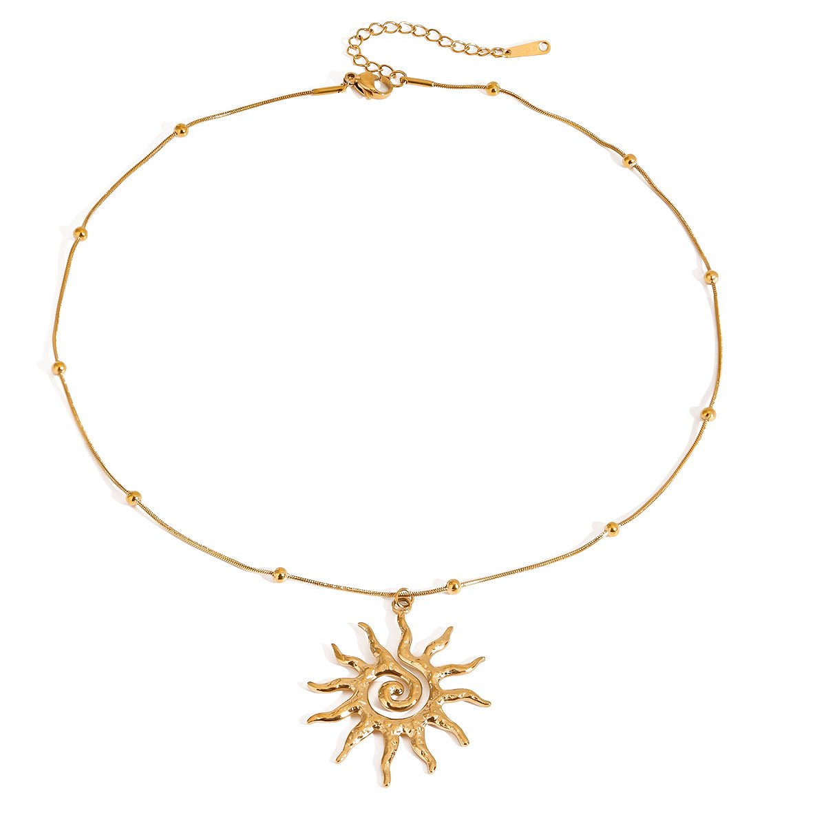 Gold necklace with a sun-shaped pendant on a white background