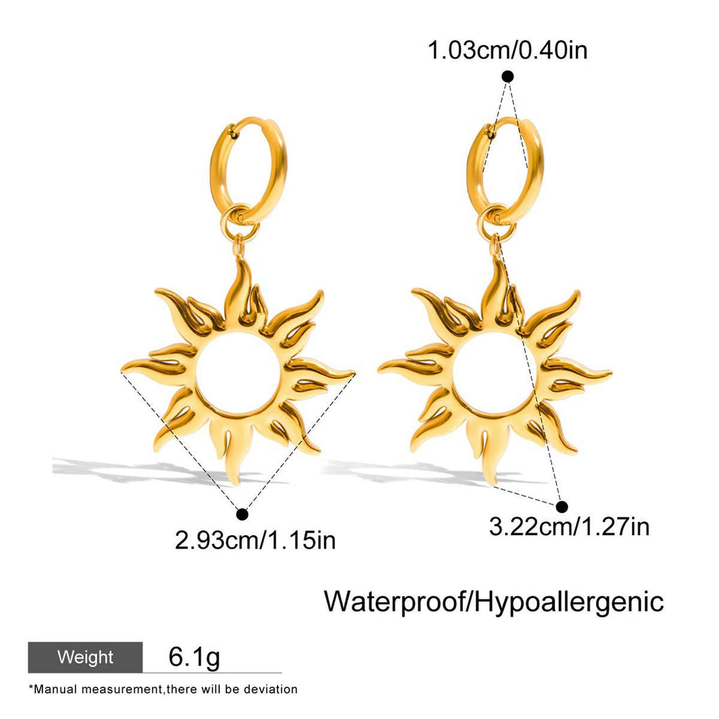 Gold sun-shaped earrings with measurements on a white background