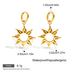 Gold sun-shaped earrings with measurements on a white background