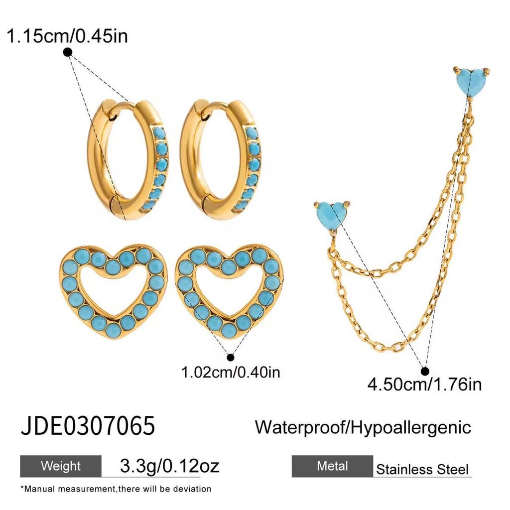Jewelry set with gold and turquoise earrings and necklace on a white background