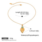 Gold necklace with pendant and measurement details on a white background