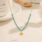 Gold and Turquoise Beaded Necklace with Sun Charm